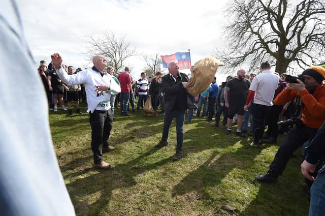 The Hare Pie is thrown onto the battlefield by Dave Marlow and Phil Allen.
