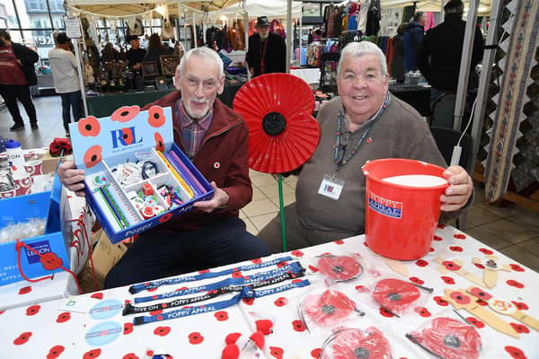 From left, John Ragg of Market Harborough Lions and Market Harborough Royal British Legion chairman Stewart Harrison on the poppy appeal stall at the indoor market.