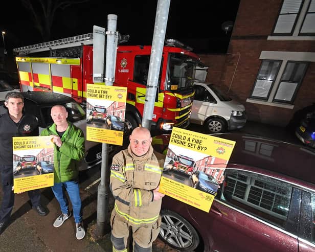 Firefighter Robert Seaton, crew manager Owain Raymond and Councillor Darren Woodiwiss on Nelson Street.
PICTURE: ANDREW CARPENTER