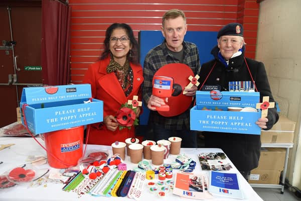 We will remember them...from left, Sheila Caberwal, Steve Sherwood and Jane Timms on the poppy stall at Harborough indoor market.
PICTURE: ANDREW CARPENTER