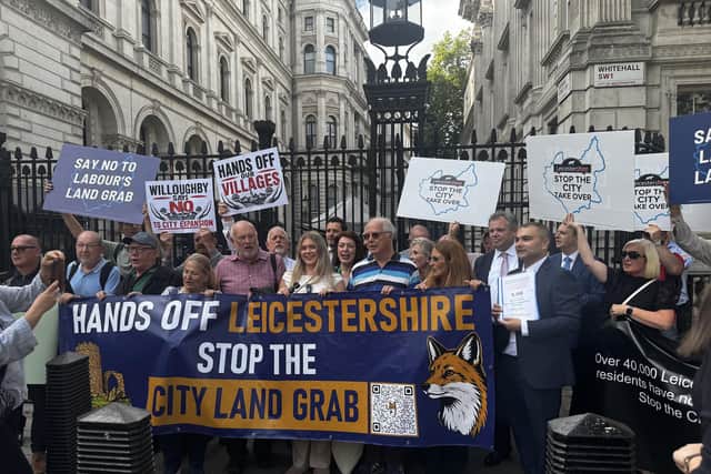 Protesters and their banners. Picture: Olivia Preston