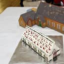 A miniature replica of the hall was created in cake form.