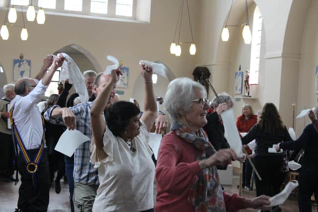 The members learned to use traditional Morris dancing props.
