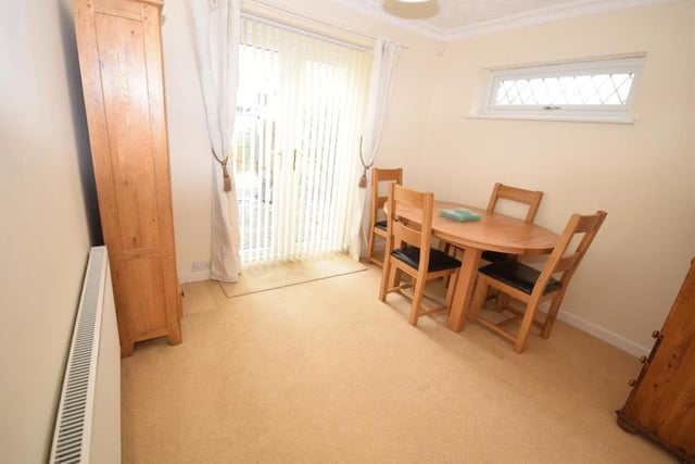 This is the bungalow's smallest bedroom, but it was successfully turned into a dining area. Decorated with coving to the ceiling, it features a radiator, uPVC window to the side and double doors opening out on to the back garden.