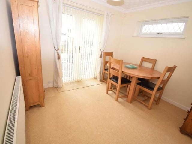 This is the bungalow's smallest bedroom, but it was successfully turned into a dining area. Decorated with coving to the ceiling, it features a radiator, uPVC window to the side and double doors opening out on to the back garden.