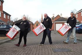 Lesley Croft, John Bush and Sarah Hill of Market Harborough Lions Club get ready for the Christmas Card delivery service.