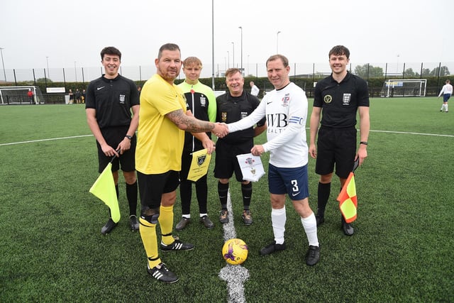 Scott Munton Harborough Town Vets captain shakes hands with England Vets captain Steve Edkins before the charity match for the Squires Effect charity.