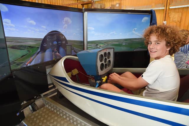 Bertie Blagburn aged eleven in a gliding simulator.