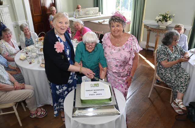 Long-serving member Jean Clarke (centre) cuts the cake with County Chairman, Glenice Wignall and President Susan Woollard.
PICTURE: ANDREW CARPENTER