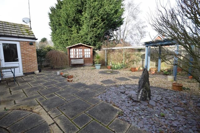 Moving outside now, and a look at the private back garden, which has been superbly maintained. It features a large and smart patio area, where you can relax with friends on warm summer evenings.