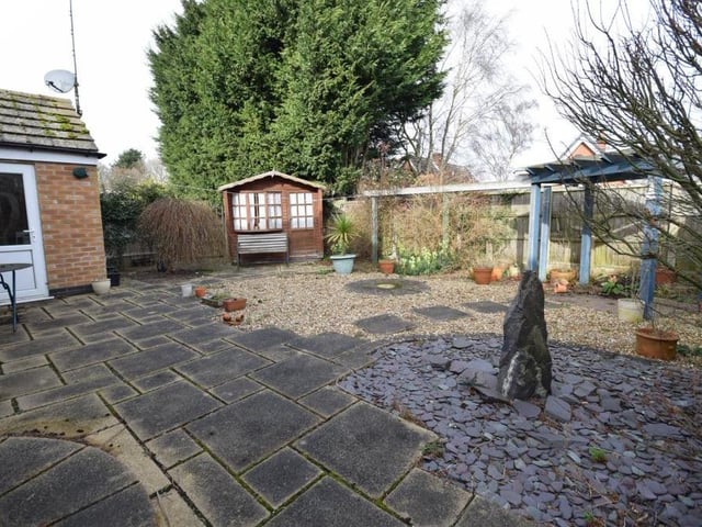 Moving outside now, and a look at the private back garden, which has been superbly maintained. It features a large and smart patio area, where you can relax with friends on warm summer evenings.
