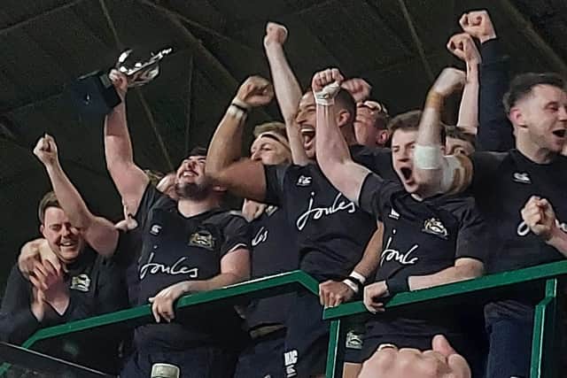 The Market Harborough players show their delight as they lift the County Cup. Picture courtesy of Market Harborough Rugby Club