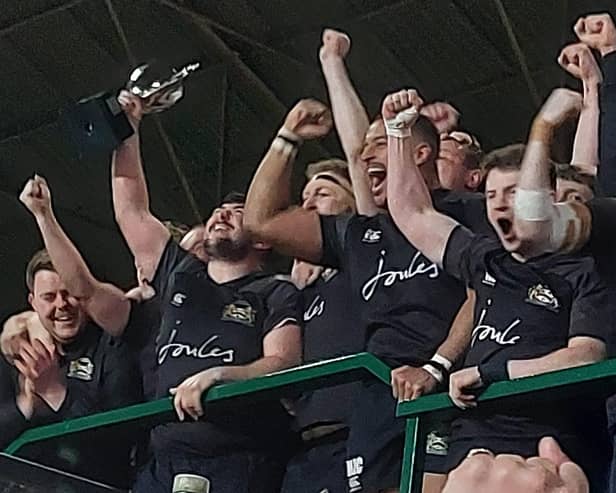 The Market Harborough players show their delight as they lift the County Cup. Picture courtesy of Market Harborough Rugby Club