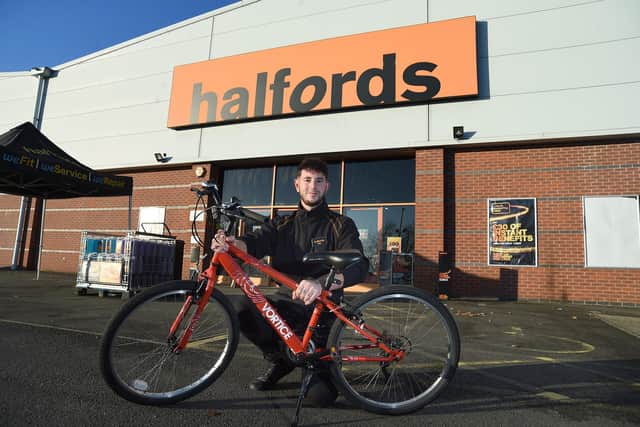 Halfords specialist Oliver Marabella with a donated bike.