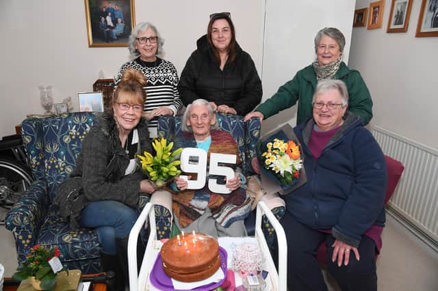 Beryl Jarvis  celebrates her 95th birthday with neighbours from left, Julie Ashden, Sue Flint, Chrissy Pike, Annette Kiff and Maddie Gardner.
PICTURE: ANDREW CARPENTER