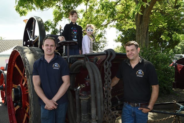 From left, Jack Brown of Marston Steam, Alfie Wright, 9, Lily Wright, 9 and Tom Wing of Wing Landscapes with Evedon Lad 1910.