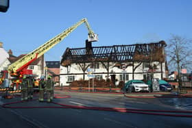 Fire fighters tackle the thatched roof fire at the Shambles pub in Lutterworth back in February.
PICTURE: ANDREW CARPENTER