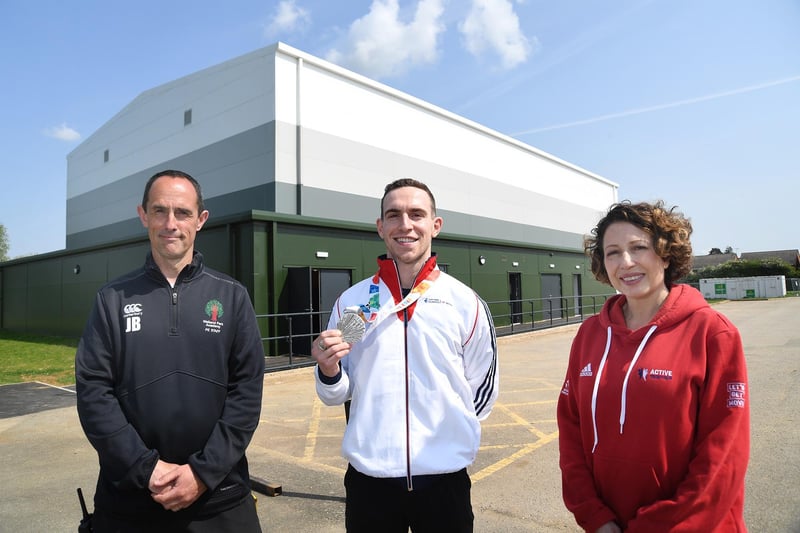 PE teacher Jason Button, Andrew Stamp and Nada Hankin outside the new sports hall at Welland Park Academy.