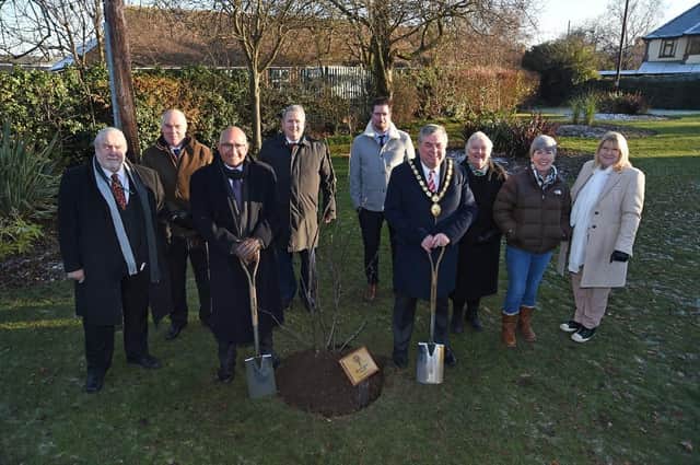 Lord Lieutenant of Leicestershire Mike Kapur OBE and Chairman of Market Harborough District Council Neil Bannister plant the tree.
