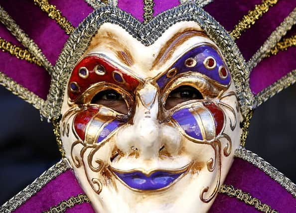 Mardi Gras parades typically feature masked and costumed participants (Getty Images)