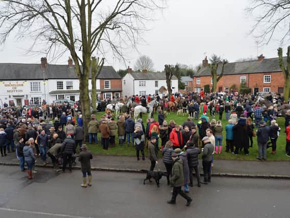Crowds gather on the green in Great Bowden during the Fernie Boxing Day Hunt meet. PICTURE: ANDREW CARPENTER