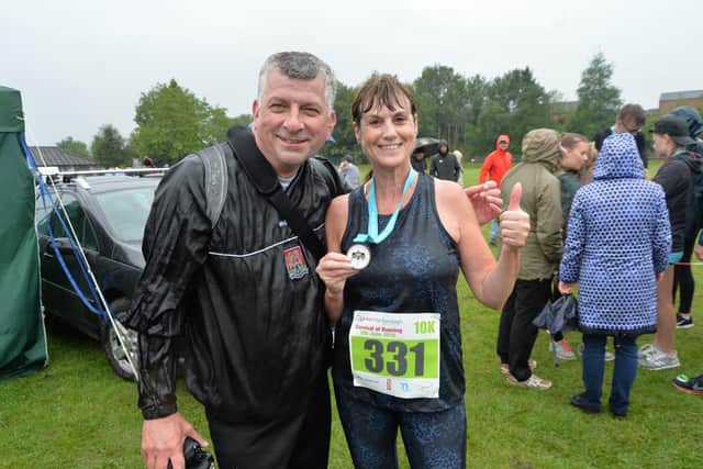 Karen Stanhope of Lutterworth after completing 10km with partner Paul Coughlan. PICTURE: ANDREW CARPENTER