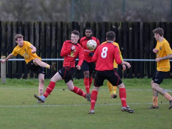 Action from Harborough Town's Boxing Day victory over Sileby Rangers. Picture by Andrew Carpenter