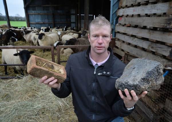 Phillip De Jager with some of the bricks and boulders thrown at his sheep in Kibworth.
PICTURE: ANDREW CARPENTER NNL-180901-123935005
