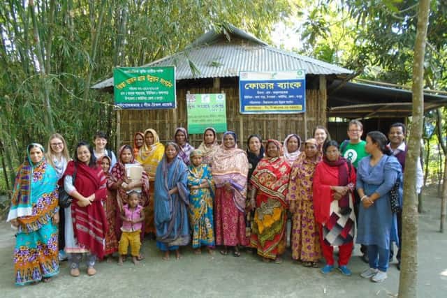 Andy and villagers who are benefiting from Oxfams Empowerment of Women project