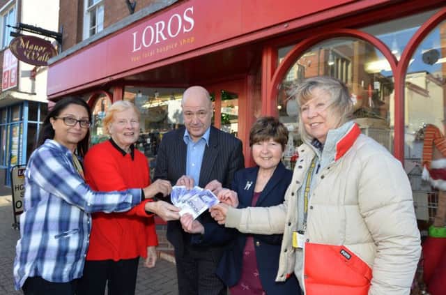 Jill Mann second left and Sandy Ward second right hand out Â£550 each to Illa Patel of Loros, Troy Young of Age UK and Gill Clutterbuck of the Air Ambulance money raised from Joan's Coach Outings.
PICTURE: ANDREW CARPENTER NNL-180123-104817005