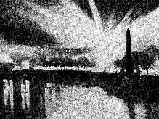 Caption: This picture from the Daily Mirror in September 1915 shows London lit up by searchlights during a
German air raid
