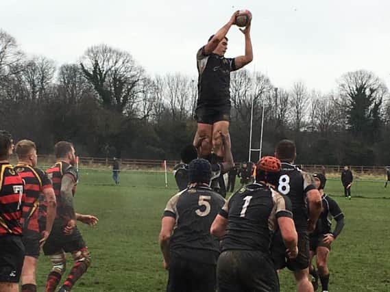 Ethan Godefroy gets up high to secure lineout ball for Market Harborough against Belgrave