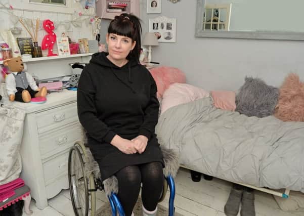 Cate Whitmore 42 is confined to the downstairs of her house after a spinal injury prevents her from climbling the stairs.
PICTURE: ANDREW CARPENTER NNL-180221-080522005