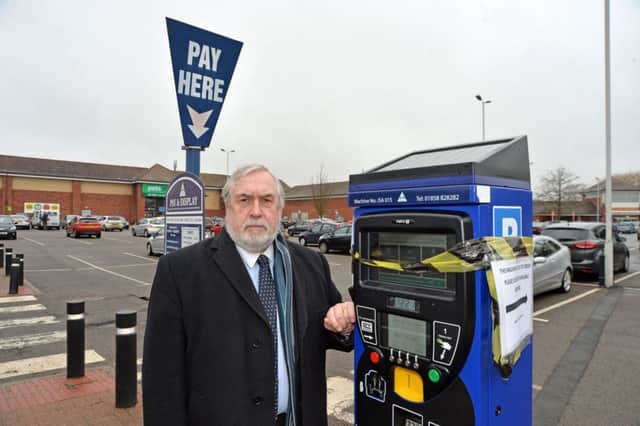 Councillor Phil Knowles at the sainsbury's car park where machines are still not working.
PICTURE: ANDREW CARPENTER NNL-180221-082833005