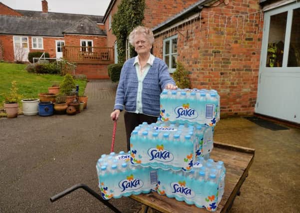 Water misery...Sylvia Charlton with her water delivery in Shangton.
PICTURE: ANDREW CARPENTER NNL-180314-090304005