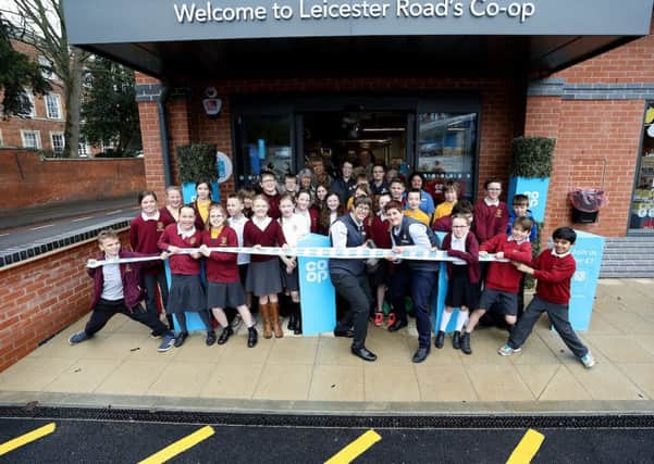 Co-Op Food store opening, Market Harborough, Leicestershire, on March 15, 2018.

Pupils from Market Harborough Church of England Academy help cut the ribbon with store manager Asha Scarlett (glasses) and assistant store manager Natasha Mitchell.