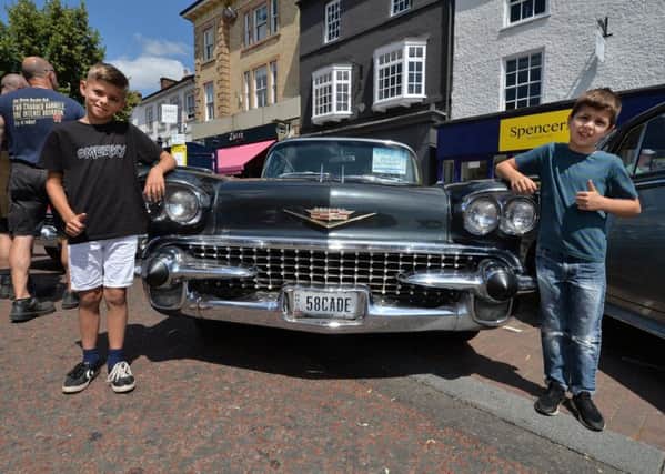 Finlay Draper 10 and Lucas Draper 8 during the classic car show in Harborough.
PICTURE: ANDREW CARPENTER NNL-180907-101010001