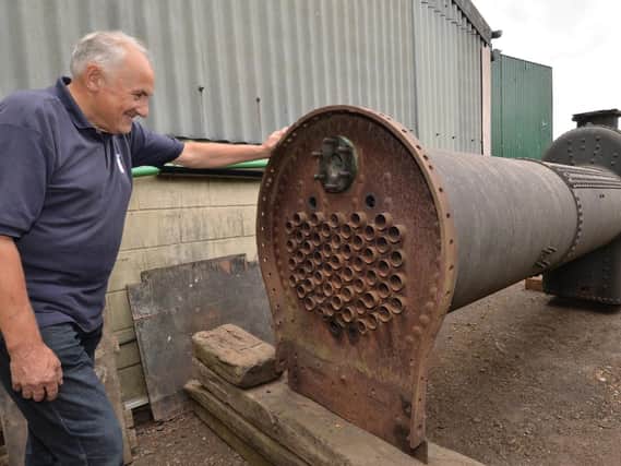 John Locke takes a closer look at the boiler. PICTURE: ANDREW CARPENTER