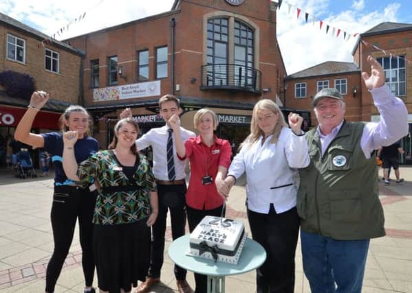 Cake cutting...Emily Foster and Liz Baines of Argos, Bailey Mcfall of Specsavers, Helen King of Wilkinsons, Suzy England of Boots and John Perry of St Mary's Place during the celebration of 25 years.
PICTURE: ANDREW CARPENTER NNL-180731-153641005