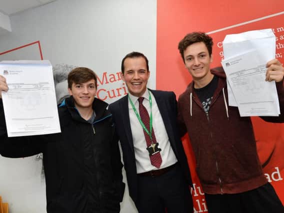 Dan Cleary principal celebrates with Aiden Barker and Ben Horspool at Robert Smyth Academy. PICTURE: ANDREW CARPENTER