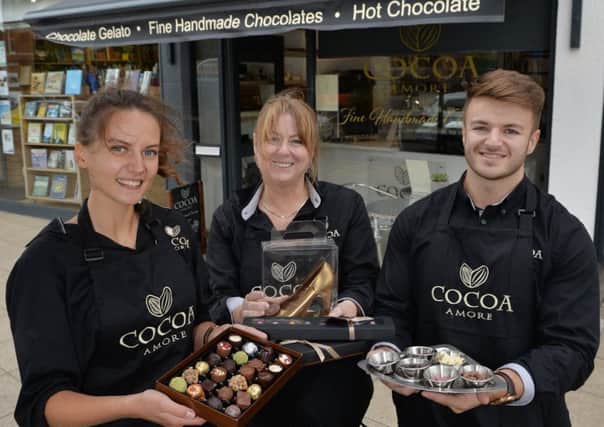 Cocoa Amore...Amelia Ellis, Cathy Whittall owner and Connor Whittall on the Square.
PICTURE: ANDREW CARPENTER NNL-181209-080121005