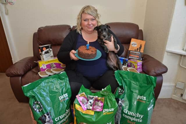 Lisa Parratt and Shadow celebrate the dog bank's first birthday.
PICTURE: ANDREW CARPENTER