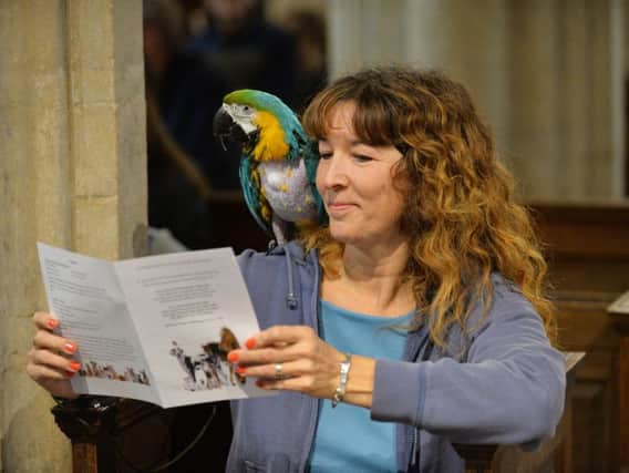 Maxine Buxton with Millie during a service of thanksgiving and blessing for pets at St Peter and St Paul in Great Bowden. PICTURE: ANDREW CARPENTER