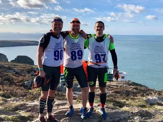 David Shiels, Mike Scott and Clem Willis in North Wales after completing the SwimRun event