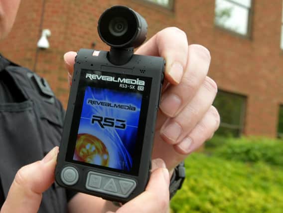 Body-worn cameras similar to this have been distributed to shopworkers