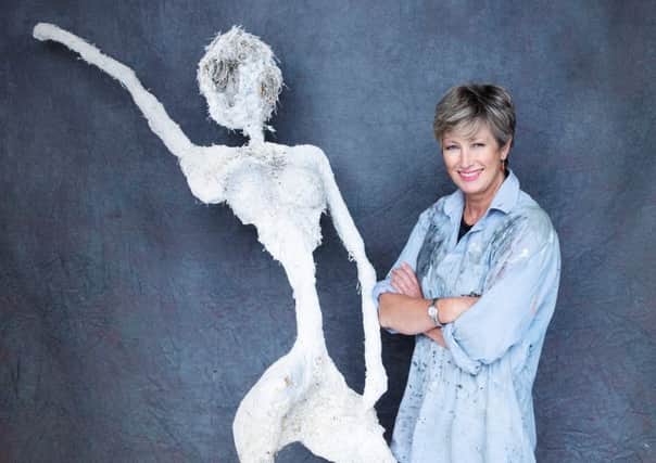Lis Naylor and one of her sculptures