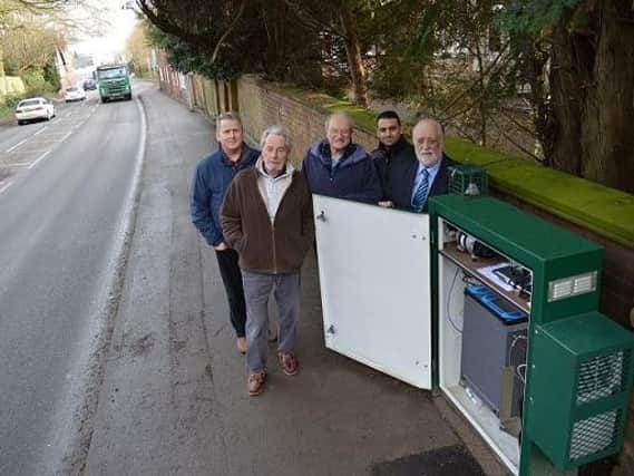 From left, Cllr Phil King from Harborough District Council, and Cllr Philip Bothwell, Cllr John Tillotson, Cllr Vijay Chavda and Cllr Kevin Feltham from Kibworth Harcourt Parish Council with the new air quality monitor