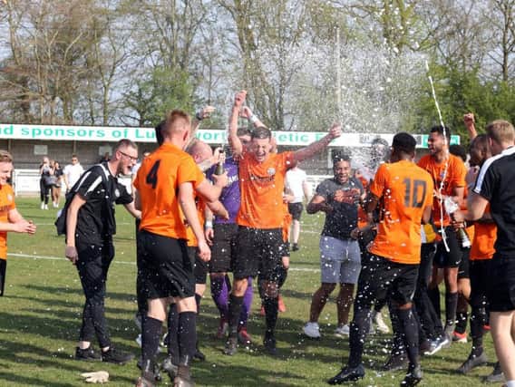 Lutterworth Town celebrate sealing promotion after victory over Lutterworth Athletic