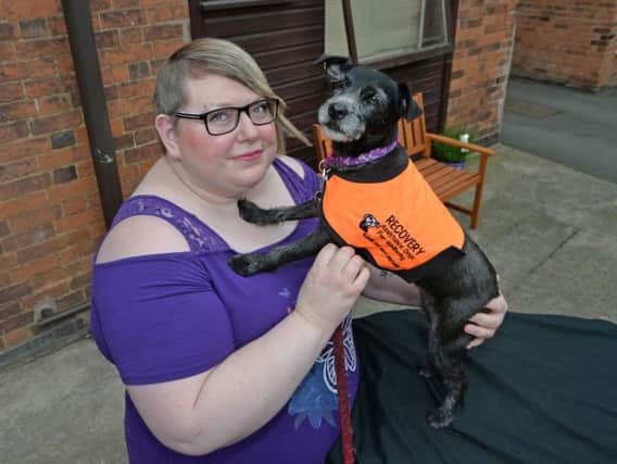 Lisa Parratt with her pet dog Shadow who is a Recovery Assistance dog for Wellbeing. PICTURE: ANDREW CARPENTER