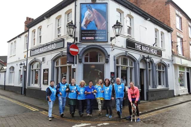 Stepping out...centre, Carole Tilley with friends set off from the Nags Head pub in Market Harborough during their annual sponsored walk this year for Guide Dogs.
PICTURE: KATIE MACKENZIE